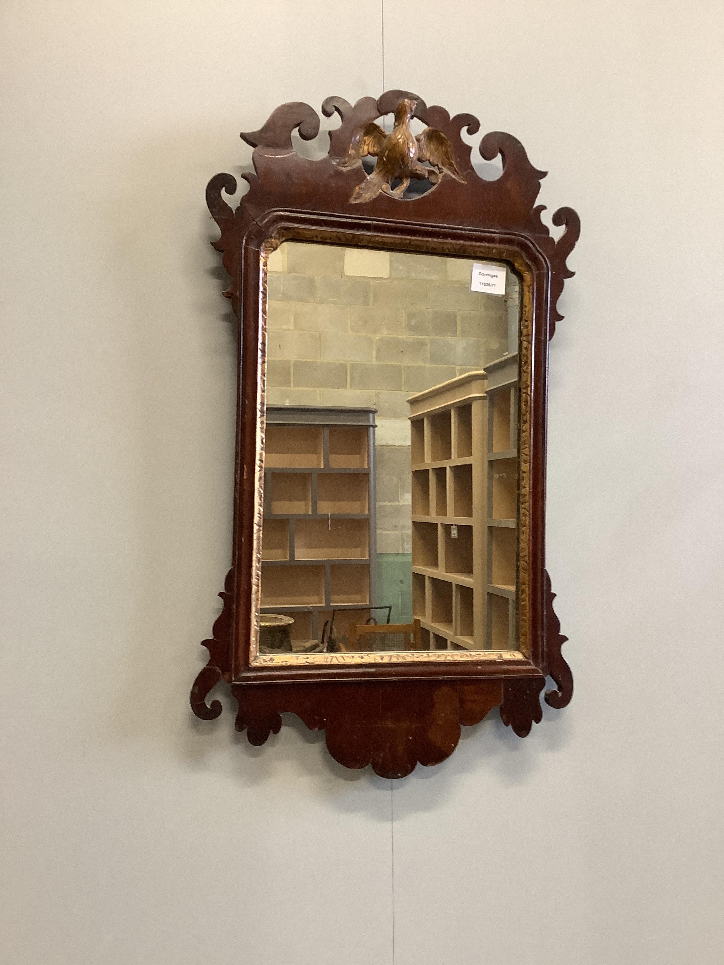 Two 18th century style walnut fret cut wall mirrors, largest width 55cm, height 70cm
